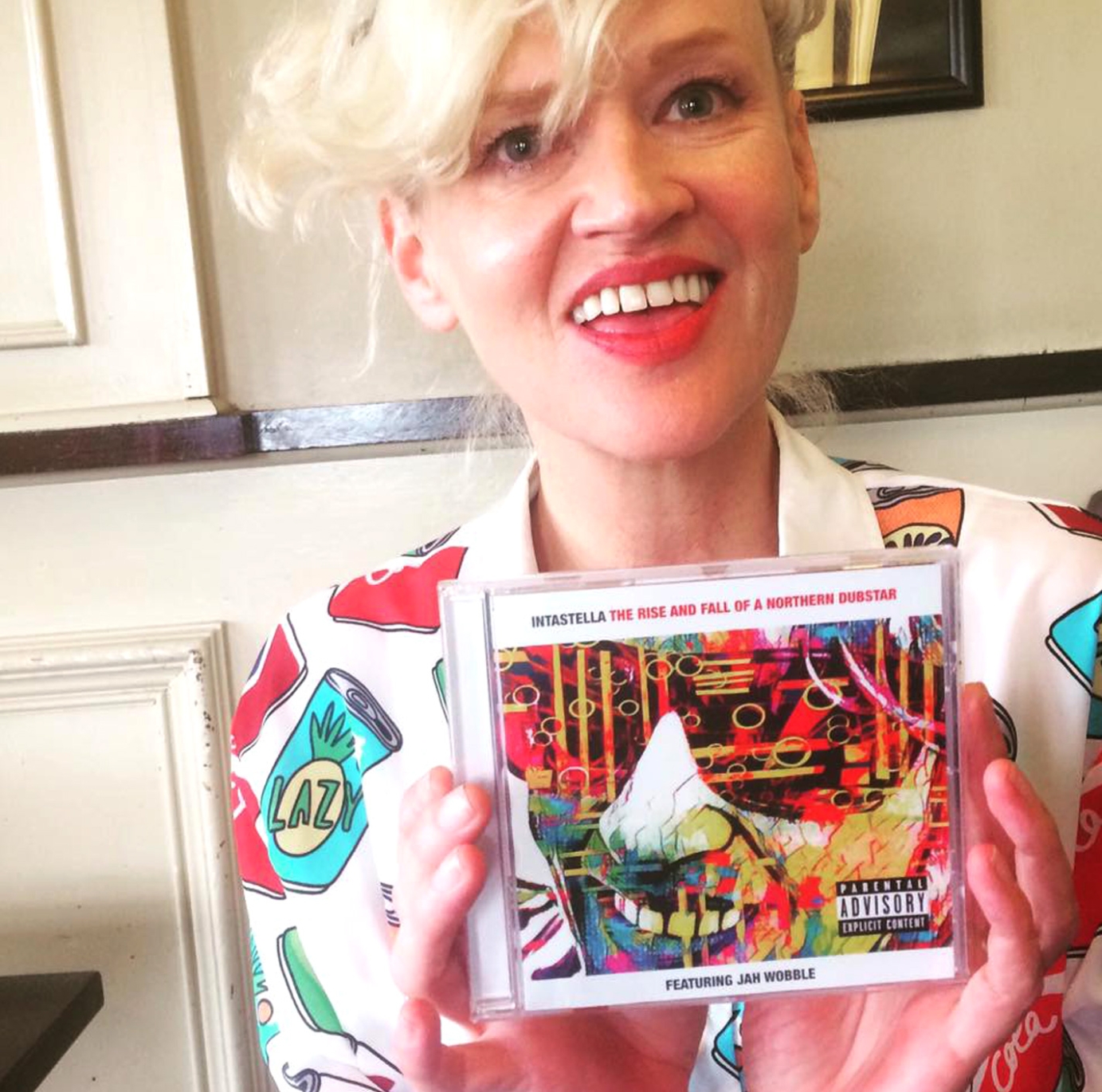 Stella Grundy holding copy of The Rise and fall of a northern Dubstar